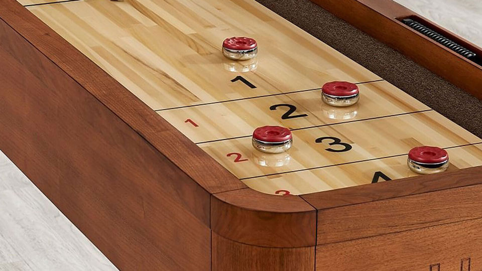 Red Shuffleboard Pucks on an Imperial 12-foot Shuffleboard Table